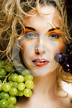 Beautiful young woman portrait excited smile with fantasy art hair makeup style, fashion girl with creative food fruit