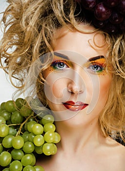 Beautiful young woman portrait excited smile with fantasy art hair makeup style, fashion girl with creative food fruit