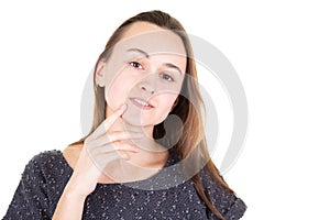 Beautiful young woman portrait hand under chin in white background