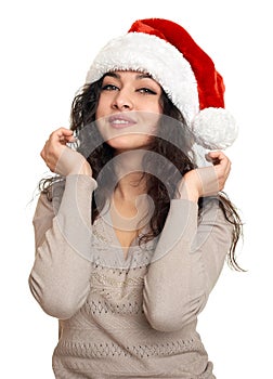 Beautiful young woman portrait in santa helper hat posing on white