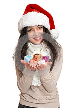 Beautiful young woman portrait in santa helper hat posing on white