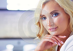 Beautiful young woman portrait , sitting in office.