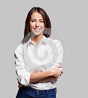 Beautiful young woman portrait. Studio shot, isolated on gray background