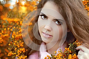 Beautiful young woman portrait, teen girl over autumn yellow par