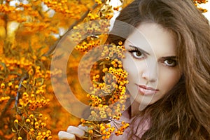 Beautiful young woman portrait, teen girl over autumn yellow par