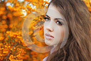 Beautiful young woman portrait, teen girl over autumn yellow par