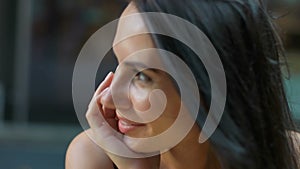 Beautiful young woman posing on camera Portrait of business woman smiling outdoor