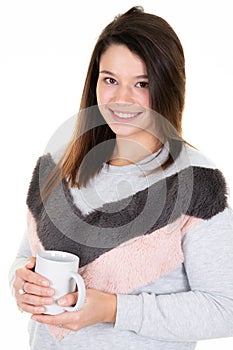 Beautiful young woman posing with cup of tea in white background