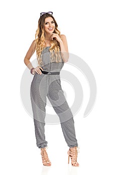 Beautiful Young Woman Is Posing In Jumpsuit And High Heels