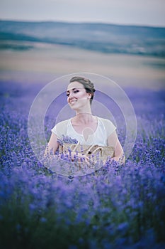 Beautiful young woman posing in a lavender field