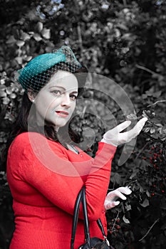 Beautiful young woman posing in vintage 1940s clothes