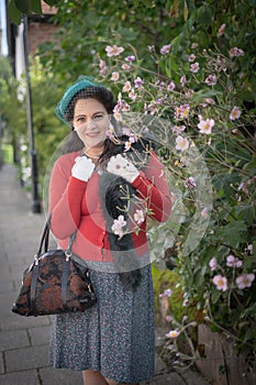 Beautiful young woman posing in vintage 1940s clothes