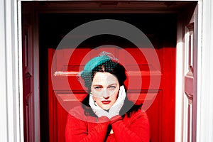 Beautiful young woman posing in vintage 1940s clothes