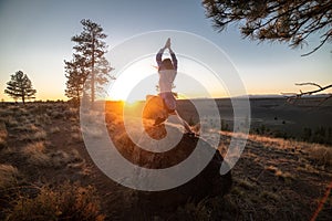 Beautiful young woman practice yoga at sunset time on nature outdoors. Healthy lifestyle concept