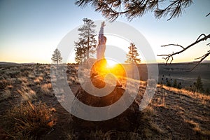 Beautiful young woman practice yoga at sunset time on nature outdoors. Healthy lifestyle concept