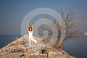 Beautiful young woman practicing yoga