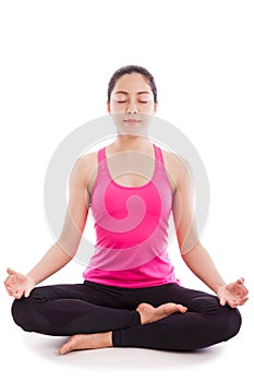 Beautiful young woman practicing yoga, sitting in a lotus position, isolate on white