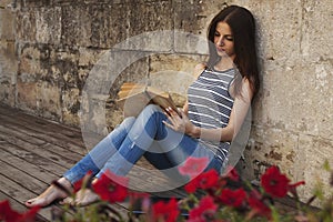 Beautiful young woman reading a book. relax, romance, poetry, r