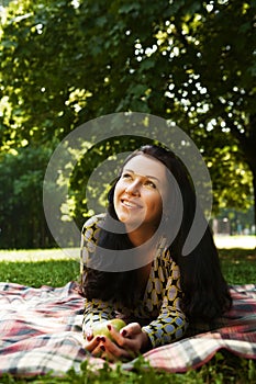 Beautiful young woman reading outdoor