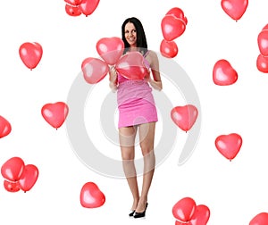 Beautiful young woman with red heart balloon