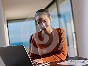 Beautiful young woman relax and work on laptop
