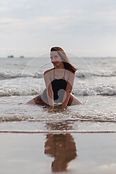 Beautiful young woman relaxing on the beach