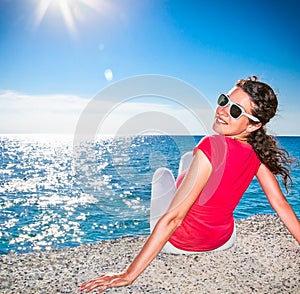 Beautiful young woman relaxing on the beach.