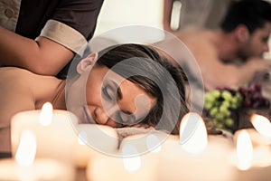 Beautiful young woman relaxing with her partner during Thai mass