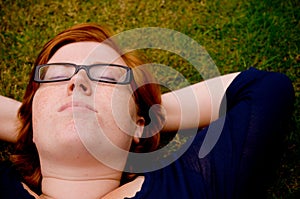 Beautiful young woman relaxing outside