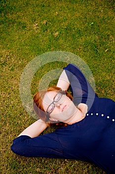 Beautiful young woman relaxing outside