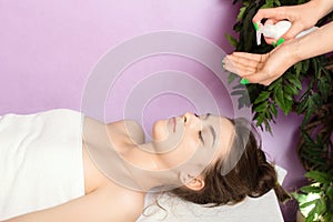 Beautiful young woman resting on a massage table. Rest and relaxation in the spa