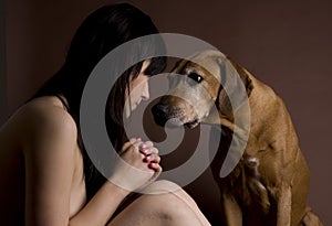 Beautiful young woman with Rhodesian Ridgeback dog