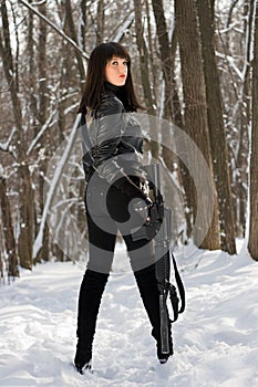 Beautiful young woman with a rifle