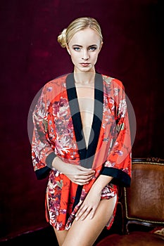 Beautiful young woman in robe.