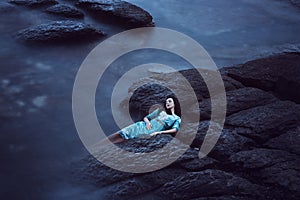 Beautiful young woman on sea