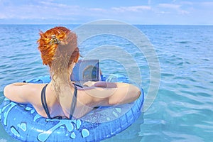 Beautiful young woman in the sea.