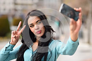 Beautiful young woman selfie in the park