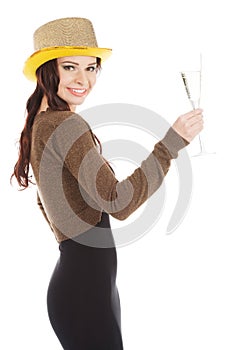 Beautiful young woman in black dress and golden hat.