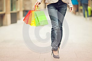 Beautiful young woman shopping in the city, mall with shopping bag