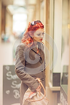 Beautiful young woman shopping in the city, mall with shopping bag