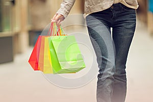 Beautiful young woman shopping in the city, mall with shopping bag