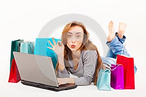 Beautiful young woman shopping over internet