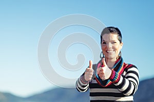 Beautiful young woman showing OK gesture.