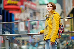 Beautiful young woman sightseeing at Times Square