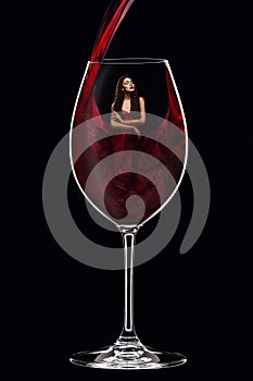 Girl in red dress inside wine glass