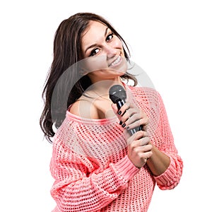 Beautiful young woman singer with microphone