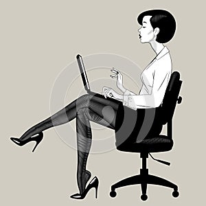 Beautiful young woman sitting on office chair with computer notebook