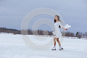 Beautiful young woman on skates