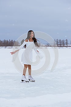 Beautiful young woman on skates