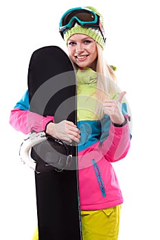 beautiful young woman in ski outfit and ski glasses hold snowboa